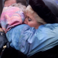 Suzanne LaPlante-Edward (right) and Michelle Lemay hug following a memorial service in Montreal, on Dec. 5, 1999. Both women had daughters killed in the 1989 Montreal Massacre. | REUTERS