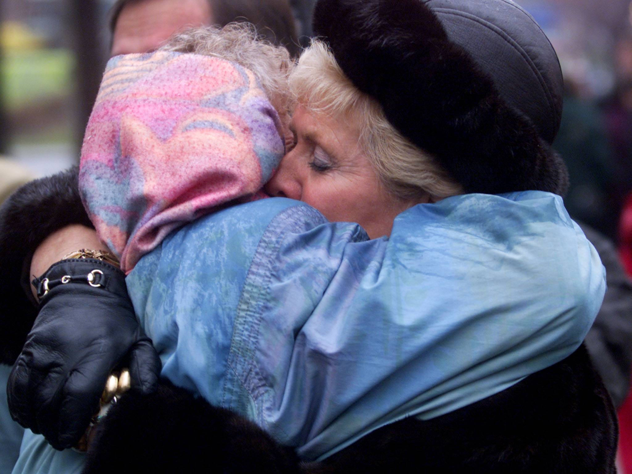 Suzanne LaPlante-Edward (right) and Michelle Lemay hug following a memorial service in Montreal, on Dec. 5, 1999. Both women had daughters killed in the 1989 Montreal Massacre. | Reuters