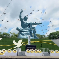Doves are released at Nagasaki\'s Peace Park on Aug. 9 of last year during a ceremony marking the 76th anniversary of the U.S. atomic bombing of the city. | POOL / VIA KYODO