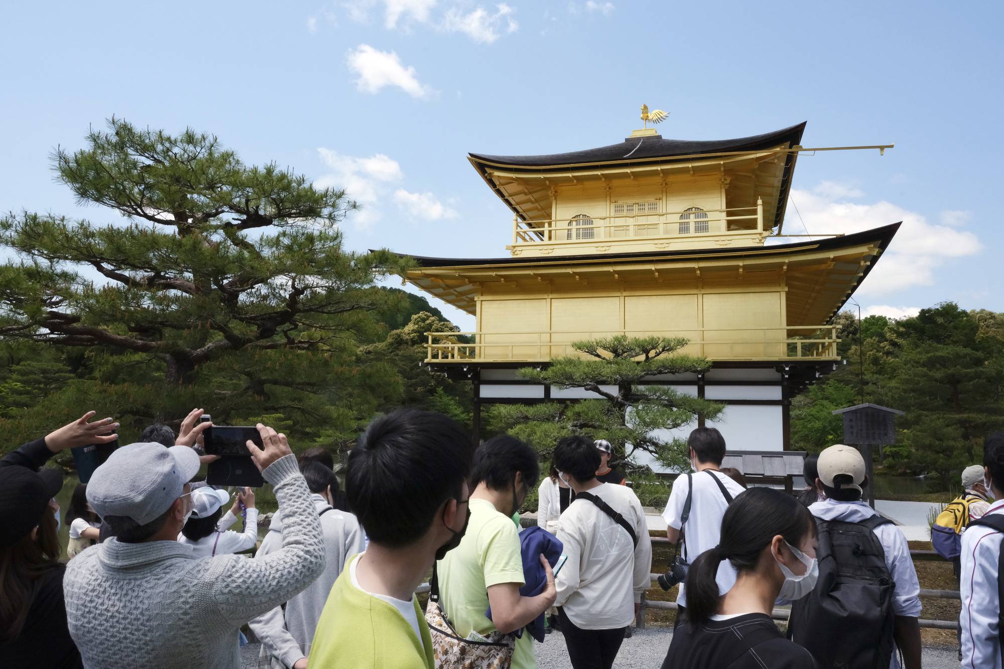 Tourists visit Kinkakuji temple in Kyoto on May 3 during the Golden Week holidays. | Bloomberg