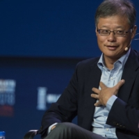 Alibaba board member and Yahoo! co-founder Jerry Yang, a user of URB-E’s mini-scooters. Yang had come on as an early investor through his AME Cloud Ventures and invested again, drawn by the company’s ambition of creating a compact container delivery network to replace trucks and small electric vehicles. | BLOOMBERG
