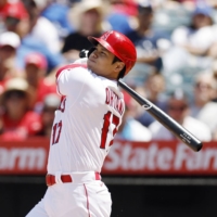 Shohei Ohtani hits a two-run home run against the Blue Jays during the third inning in Anaheim, California, on Sunday. | KYODO