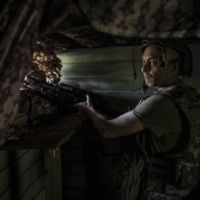 A Ukrainian soldier at a defensive position during artillery exchanges with Russian forces in Ukraine\'s eastern Donetsk region on Sunday.  | FINBARR O\'REILLY / THE NEW YORK TIMES