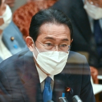 Prime Minister Fumio Kishida answers questions during an Upper House Budget Committee session in parliament on Tuesday. | AFP-JIJI