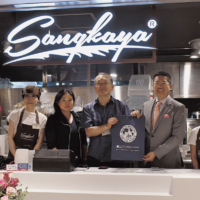 Malaysia External Trade Development Corp.’s Japan Trade Commissioner Niqman Rafaee Mohd Sahar (second from right) poses with Sankaya Japan’s Representative Director Shinji Takeuchi (center) at the Kichijoji store’s soft launch in Tokyo on June 20. | EDLEEN OTHMAN