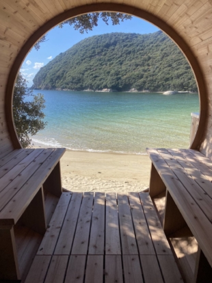 The site's sauna looks out onto the beach and far off Urashima Temple. | COURTESY OF URASHIMA VILLAGE 