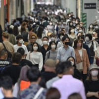 The government said recently that wearing masks outdoors is not necessary providing people maintain social distancing, with the approach of summer increasing the risk of heatstroke. | KYODO