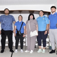 Ukrainian wrestlers, including two-time world championship bronze medalist Oleksandr Veresiuk (second from left), visit the Ukrainian embassy in Tokyo\'s Minato ward on Tuesday. | KYODO