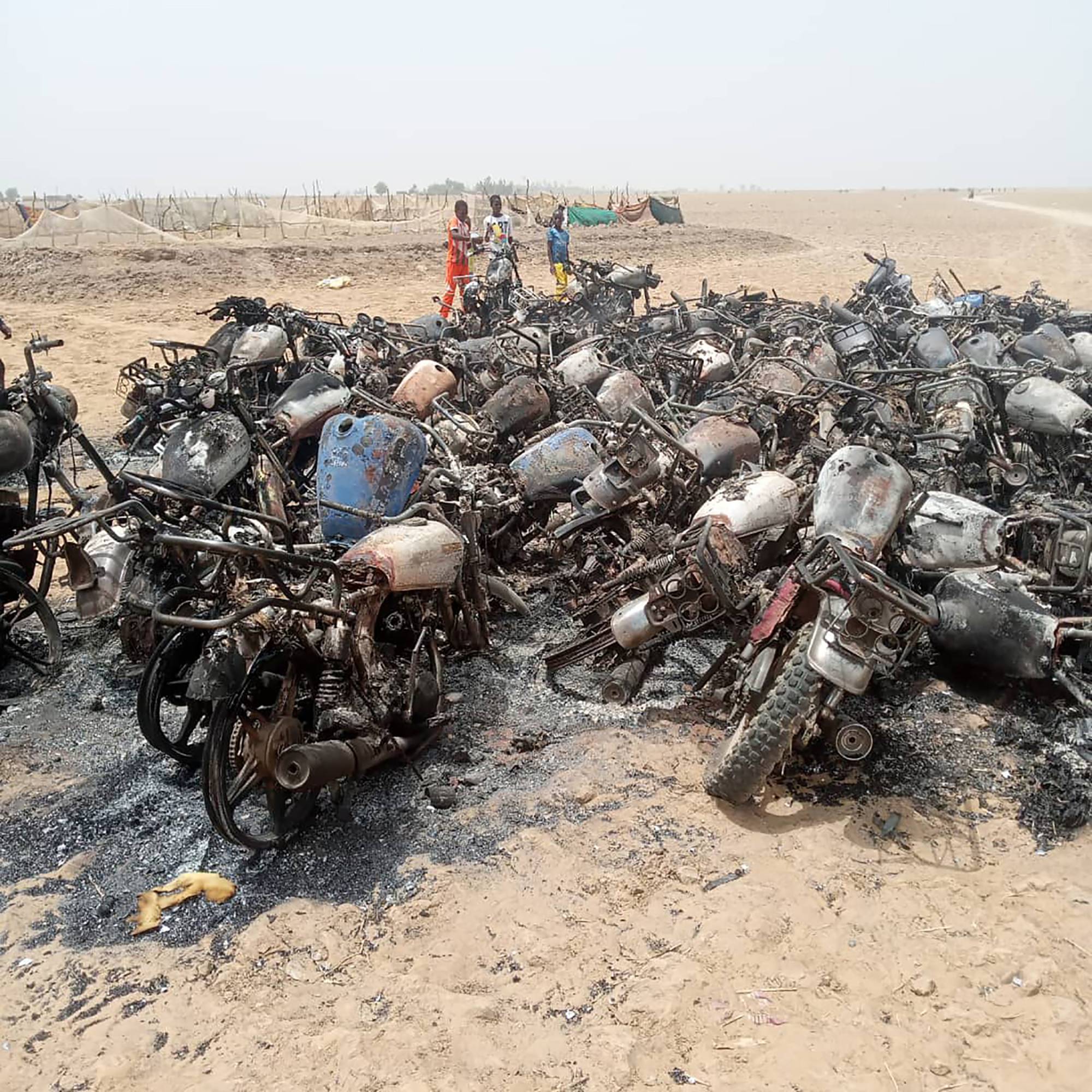 Dozens of motorcycles that were burned in March in the town of Moura in Mali | via The New York Times
