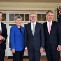 Australian Prime Minister Anthony Albanese (center) with his new cabinet ministers, Jim Chalmers (left), Penny Wong (second from left), Richard Marles (second from right) and Katy Gallagher after the oath taking ceremony at Government Housen in Canberra, on May 23. | AFP-JIJI