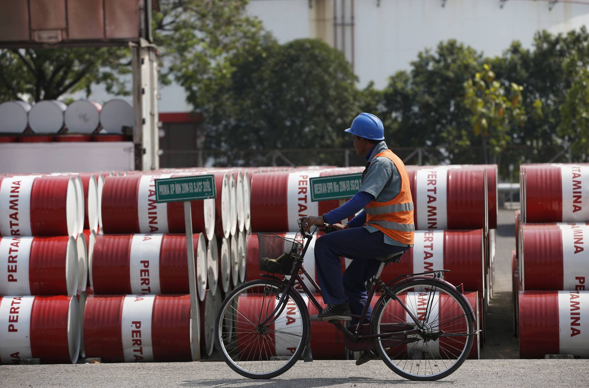 Barrels of petroleum products at a state-owned Pertamina fuel depot in Jakarta in 2014. Over the past three years, East and Southeast Asia have felt the pinch of reduced green energy funding the most, with the organizations warning the pandemic could cause further cuts. | REUTERS