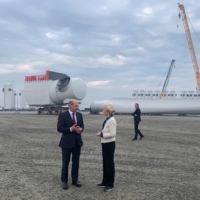 German Chancellor Olaf Scholz and President of the European Commission Ursula von der Leyen talk next to wind turbine parts at the port of Esbjerg, Denmark, on May 18. | REUTERS