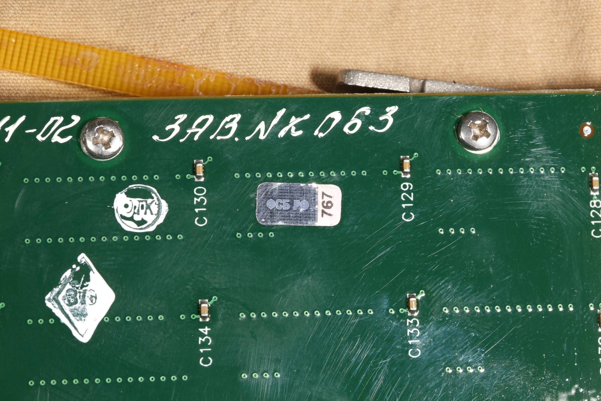 A printed circuit board collected in Ukraine from a Russian cruise missile’s internal computer | Conflict Armament Research / via The New York Times 