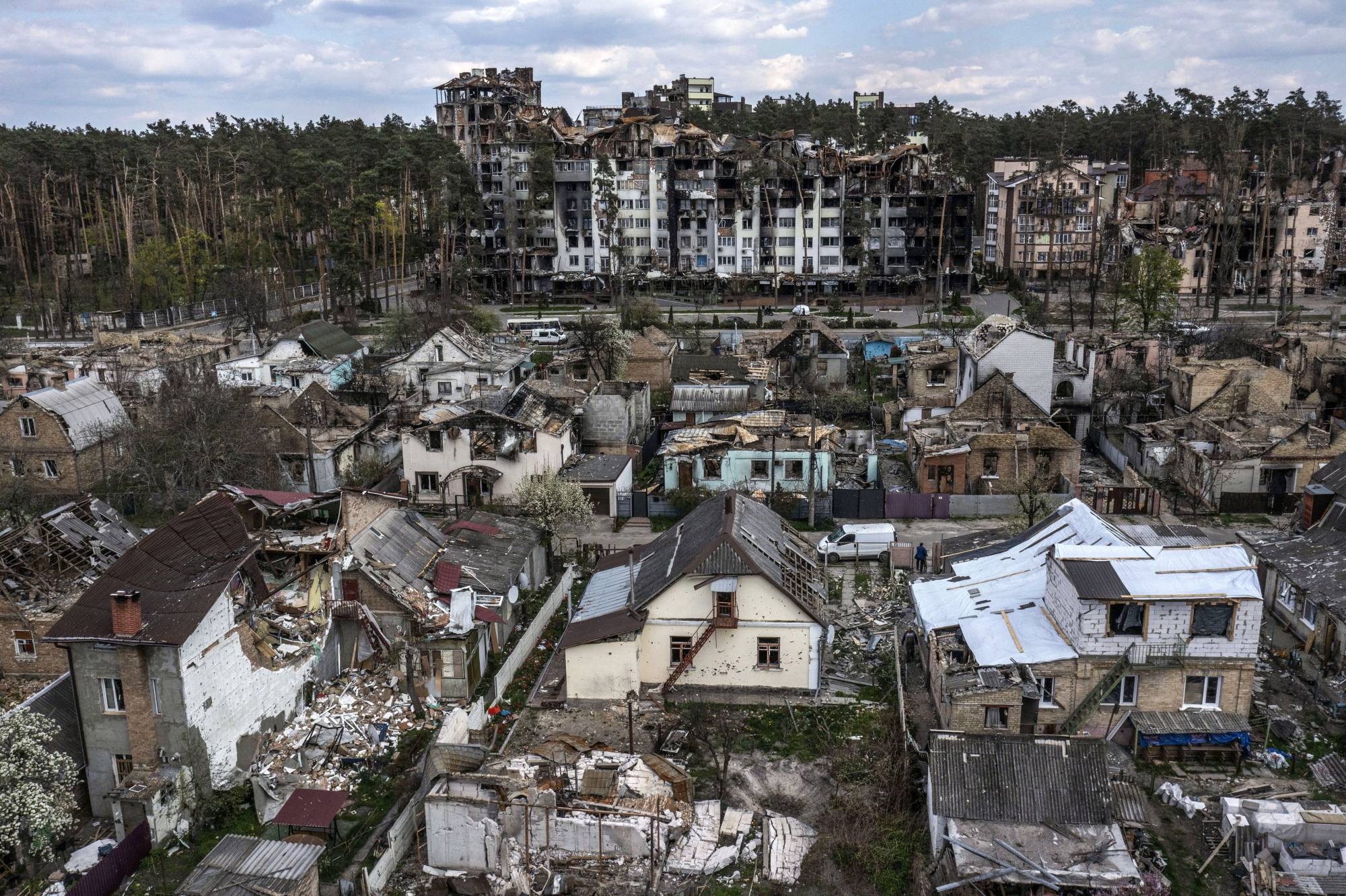 Houses, and buildings are in ruins at Irpin, a suburb of Kyiv, after weeks of Russian attacks on Ukraine on May 2. | David Guttenfelder / The New York Times