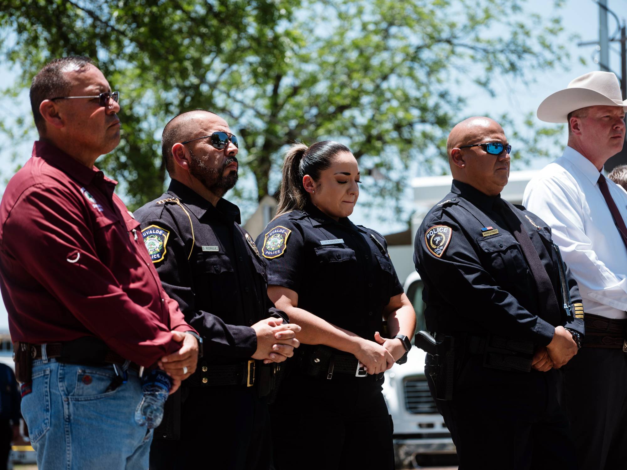 Chief Pete Arredondo (second from right) at a news conference in Uvalde, Texas, on May 26. Arredondo, the commander at the scene of the mass shooting at Robb Elementary School, arrived without a police radio, and decided in the first minutes on an approach that would delay a confrontation.  | CHRISTOPHER LEE / THE NEW YORK TIMES