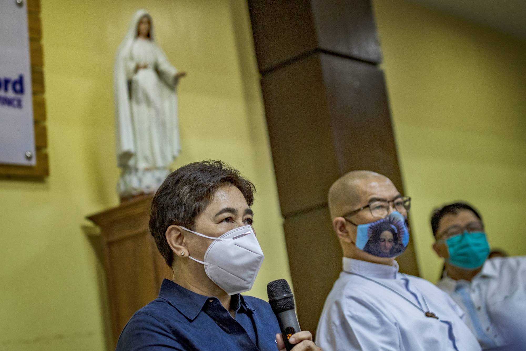 Raquel Fortun (left) and the Rev. Flaviano Villanueva, a Catholic priest who has been helping families of drug war victims, present their findings on drug war deaths during a news conference in Manila on April 12. Fortun, one of only two forensic pathologists in the Philippines, is using her skills to show how other doctors falsely claimed some victims of the country’s drug war had died natural deaths. | Ezra Acayan / The New York Times