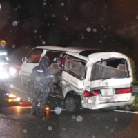 A minivan being removed from a highway in Kanagawa Prefecture in June 2017 after being rear-ended by a truck following a road-rage accident | KYODO