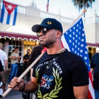 Henry \"Enrique\" Tarrio, former leader of The Proud Boys during a protest in Miami on July 16. Tarrio, as well as four other members of the far-right group, were indicted on sedition charges on Monday in connection with the Jan. 6, 2021, assault on the U.S. Capitol. | AFP-JIJI