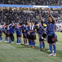 Japan\'s Maya Yoshida (second from right) with teammates after an international friendly against Brazil at the National Stadium on Monday. | REUTERS