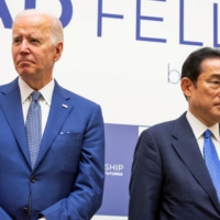Prime Minister Fumio Kishida and U.S. President Joe Biden attend a \"Quad\" event in Tokyo on May 24. | POOL / VIA REUTERS