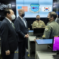 U.S. President Joe Biden and Yoon visit the Osan Air Base in Pyeongtaek, South Korea, on May 22. | DOUG MILLS / THE NEW YORK TIMES
