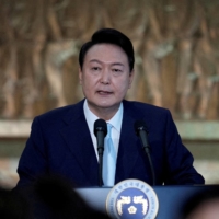 South Korean President Yoon Suk-yeol speaks during an inaugural reception at the National Assembly in Seoul on May 10. | POOL / VIA REUTERS 