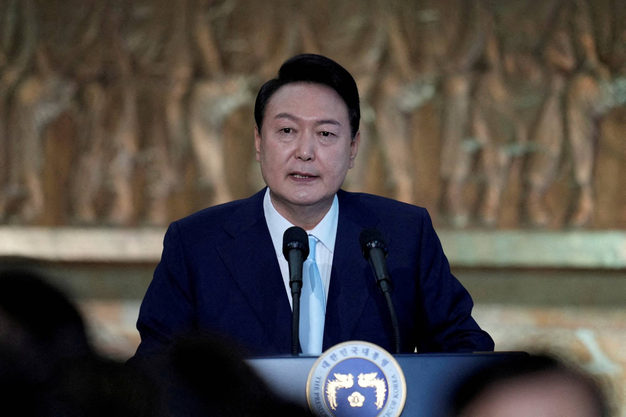 South Korean President Yoon Suk-yeol speaks during an inaugural reception at the National Assembly in Seoul on May 10. | Pool / via Reuters 