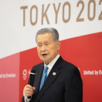 Then-Tokyo 2020 Olympics chief Yoshiro Mori announces his resignation in Tokyo on Feb. 12, 2021.  | POOL / VIA REUTERS