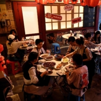 A restaurant in Beijing on Monday following an easing of COVID-19 restrictions | AFP-JIJI