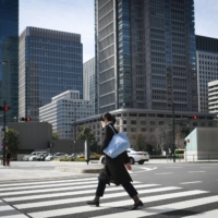 Japan\'s economy shrank an annualized real 0.5% in the January-March period, upwardly revised from the initially reported 1.0% contraction despite the continued fallout from the coronavirus pandemic. | BLOOMBERG