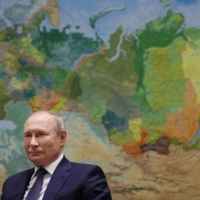 Russian President Vladimir Putin gives an interview to Rossiya-1 TV channel in Sochi, Russia on Friday. | SPUTNIK / MIKHAIL KLIMENTYEV / KREMLIN VIA REUTERS 