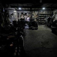 A worker operates a lathe machine as he fixes a gear box at a small scale manufacturing unit in Ahmedabad, India, on May 28.  | REUTERS