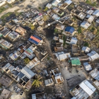 Debris and destroyed buildings from the cyclone in Beira, Mozambique, in March 2019. More than three years since Cyclone Idai devastated the fish market in the city of Beira, many are still doing business in makeshift plastic shelters that are poorly equipped and provide little respite from the hot sun. | BLOOMBERG
