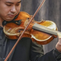 A Stradivarius violin which was sold for over $15 million in New York is played at an event in Tokyo in May before the auction. | KYODO