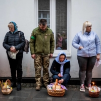 People attend a blessing of traditional Easter food baskets amid the Russian invasion in Zhytomyr, Ukraine, on April 23. REUTERS | REUTERS 
