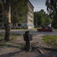 An unexploded Russian rocket in Lysychansk, one of the last Ukrainian-held cities in Luhansk Oblast, on Wednesday. | IVOR PRICKETT / THE NEW YORK TIMES

