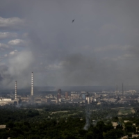 Smoke fills the sky over Sievierodonetsk where intense fighting is taking place between Russian and Ukrainian forces.  | IVOR PRICKETT / THE NEW YORK TIMES

