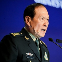 Chinese Defense Minister Wei Fenghe speaks at the Shangri-La Dialogue security forum in Singapore on Sunday. | REUTERS