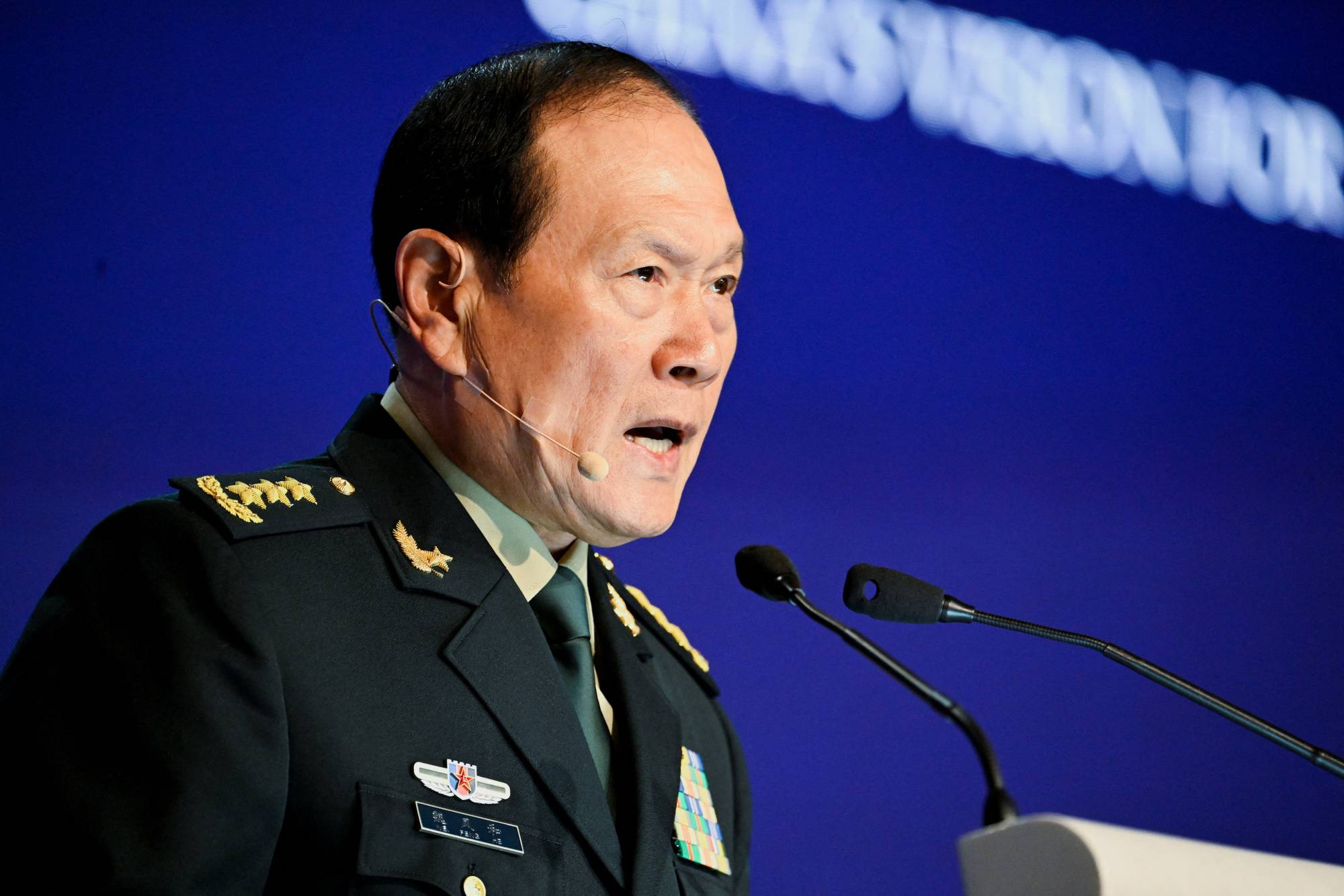 Chinese Defense Minister Wei Fenghe speaks at the Shangri-La Dialogue security forum in Singapore on Sunday. | REUTERS
