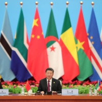 Chinese President Xi Jinping speaks next to South African President Cyril Ramaphosa during the 2018 Beijing Summit of the Forum On China-Africa Cooperation in Beijing. | POOL / VIA REUTERS 