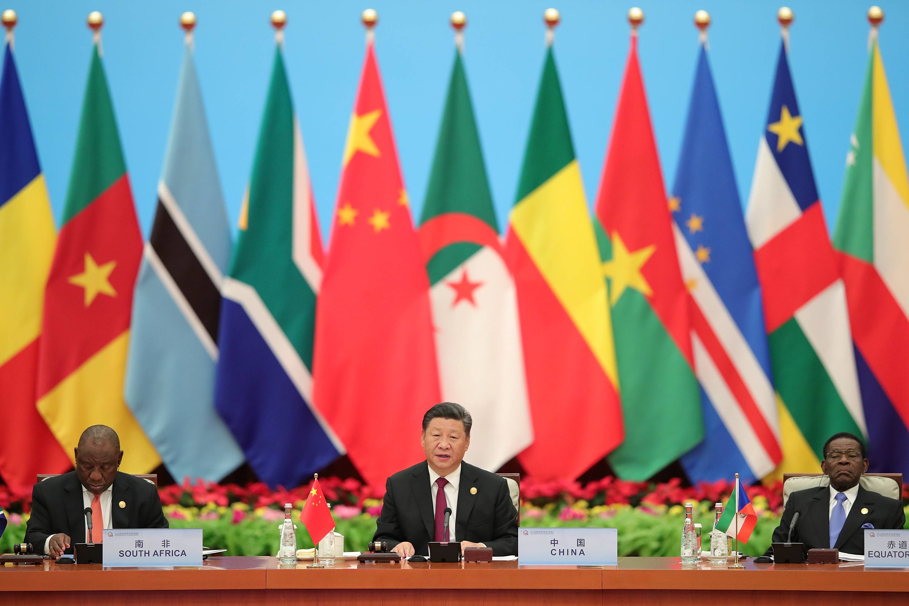 Chinese President Xi Jinping speaks next to South African President Cyril Ramaphosa during the 2018 Beijing Summit of the Forum On China-Africa Cooperation in Beijing. | Pool / via REUTERS 