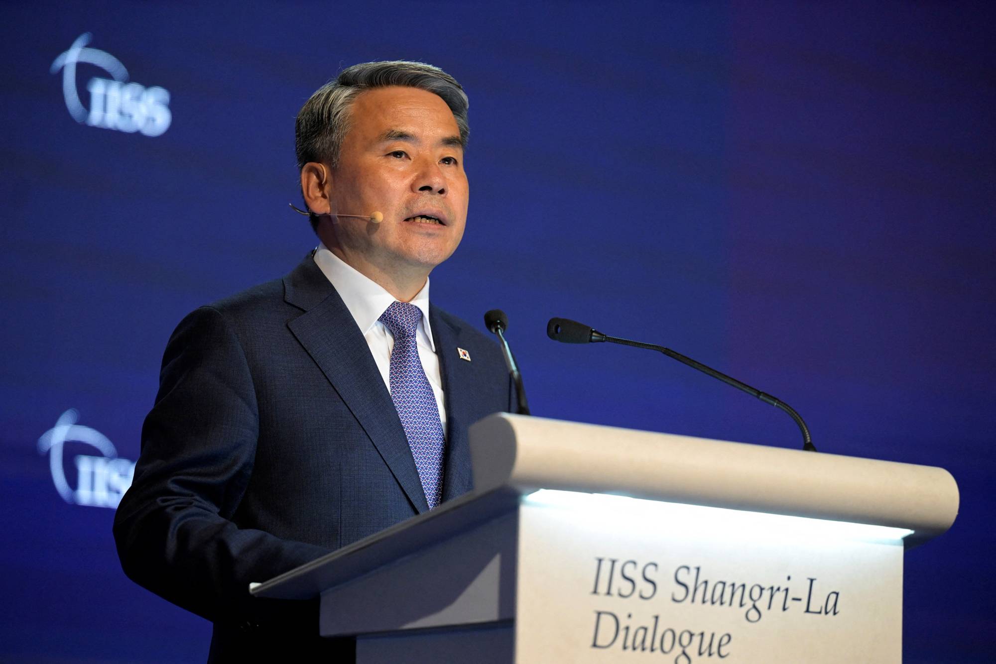 South Korean Defense Minister Lee Jong-sup speaks at a plenary session of the Shangri-La Dialogue in Singapore on Sunday. | REUTERS