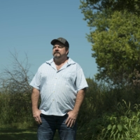 Ron Meek, a former meat processor, in Wever, Iowa, in 2021. An influential system overseen by retailers and clothing makers ranks petroleum-based synthetics like “vegan leather” as more environmentally sound than natural fibers. | NEETA SATAM / THE NEW YORK TIMES