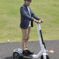 Striemo\'s three-wheeled electric scooter. The scooter is designed to handle bumpy roads or slopes and prevent some of the accidents that have plagued other types of stand-up scooters. | KYODO
