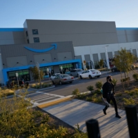 An employee leaving Amazon\'s San Diego facility | BLOOMBERG