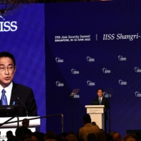 Prime Minister Fumio Kishida delivers the keynote address at the Shangri-La Dialogue summit in Singapore on Friday. | AFP-JIJI