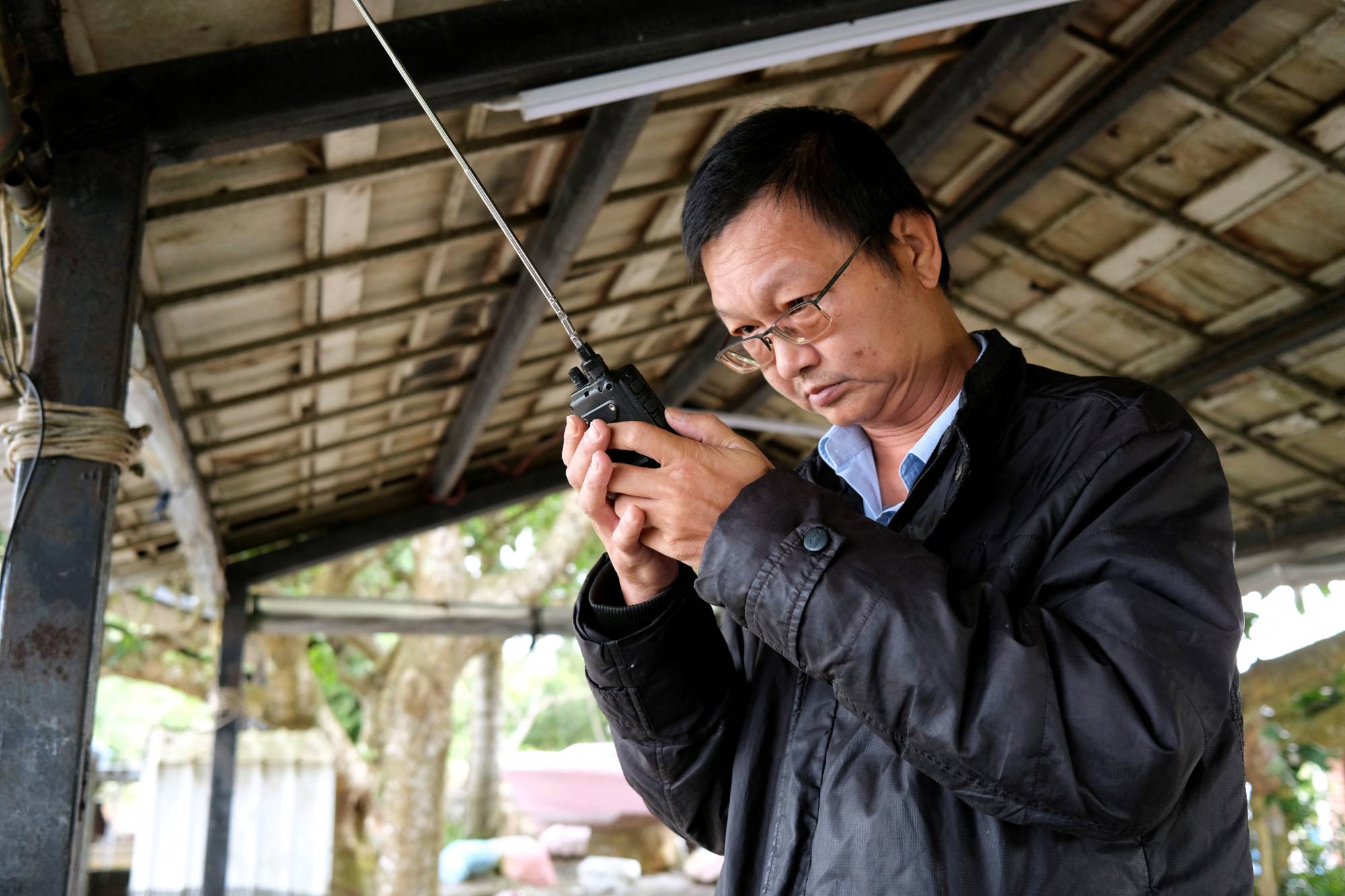 Radio enthusiast Robin Hsu monitors flight traffic in air space southwest of Taiwan, at a cafe in Pingtung, Taiwan, on May 3. | REUTERS 