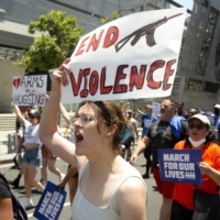 Nora Thompson participates in the March For Our Lives demonstration against gun violence in Los Angeles on Saturday. More than 300 rallies were scheduled across the country on Saturday.  | IVAN KASHINSKY / THE NEW YORK TIMES
