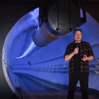 Elon Musk, co-founder and chief executive officer of Tesla, speaks during an unveiling event for the Boring Co. Hawthorne test tunnel in Hawthorne, California, in 2018.  | BLOOMBERG