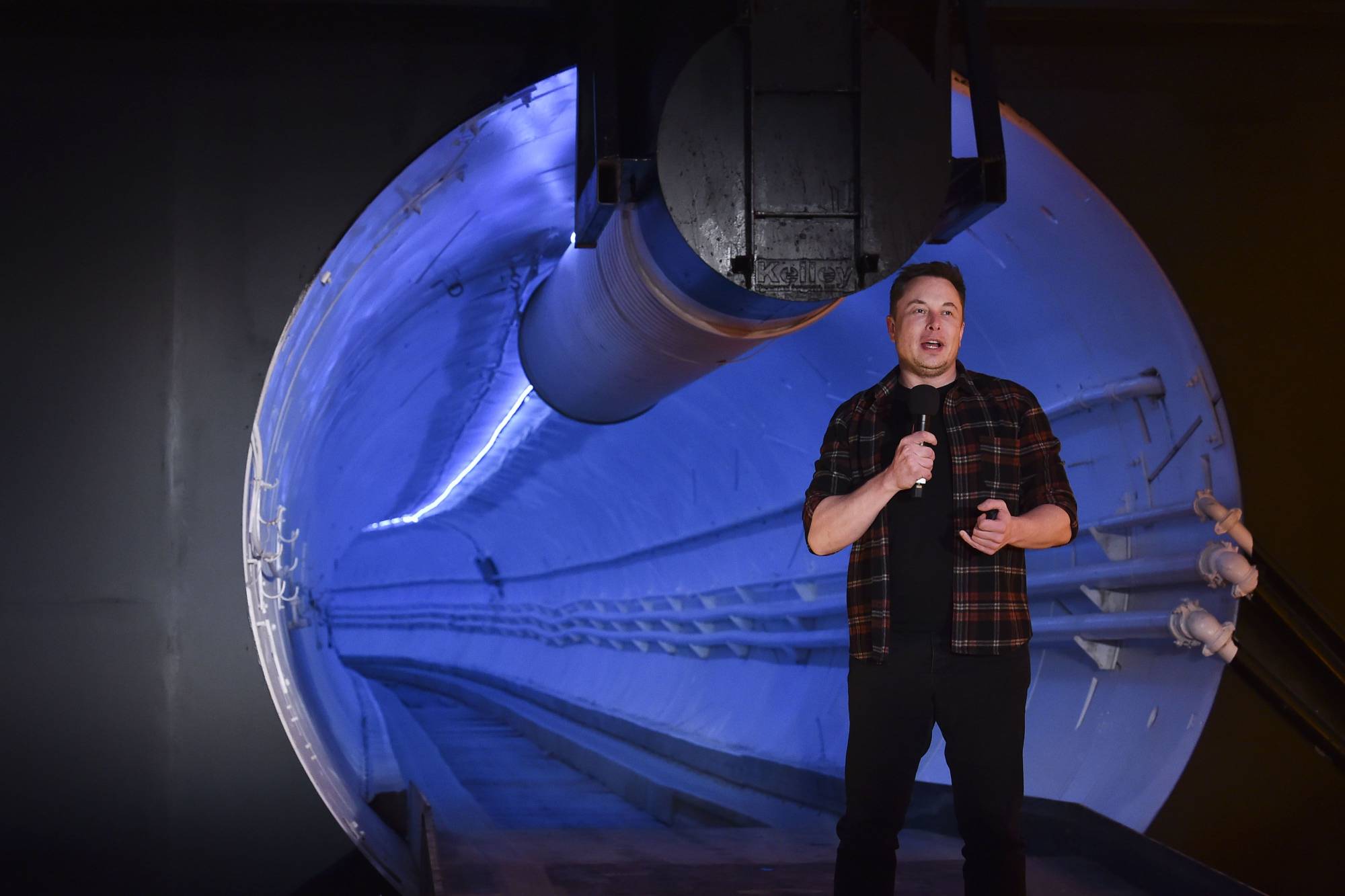 Elon Musk, co-founder and chief executive officer of Tesla, speaks during an unveiling event for the Boring Co. Hawthorne test tunnel in Hawthorne, California, in 2018. | Bloomberg